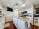 Kitchen island with granite countertop, pendant lighting, and stainless steel appliances at 1137 Indian Rocks S Rd, Largo, FL 33770