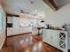 Bright, modern kitchen with white cabinets, stainless steel appliances, and a kitchen island with bar seating at 1137 Indian Rocks S Rd, Largo, FL 33770