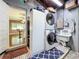 Interior laundry room with stackable washer/dryer unit and utility sink at 1137 Indian Rocks S Rd, Largo, FL 33770