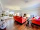 Open-concept living room with hardwood floors, recessed lighting, and a comfortable seating area with stylish furniture at 1137 Indian Rocks S Rd, Largo, FL 33770