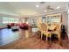 Spacious living room with bright natural light, hardwood floors, and comfortable red furniture at 1137 Indian Rocks S Rd, Largo, FL 33770