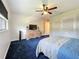 Spacious main bedroom with a ceiling fan, large closet, and a window providing natural light at 1137 Indian Rocks S Rd, Largo, FL 33770
