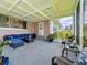 Spacious screened-in patio with comfortable seating, perfect for outdoor relaxation and entertaining at 1137 Indian Rocks S Rd, Largo, FL 33770