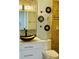 Charming bathroom showcasing unique bowl sink, mosaic tile wall, decorative mirrors, and vanity at 6806 Monique Ave, Tampa, FL 33625