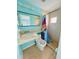 Updated bathroom with a modern sink, toilet, and walk-in shower with a colorful shower curtain at 6806 Monique Ave, Tampa, FL 33625