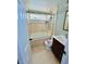 Bathroom with shower and jacuzzi tub combination, vanity and decorative toilet at 6806 Monique Ave, Tampa, FL 33625