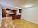 Modern kitchen features stainless steel refrigerator, kitchen island, and hardwood cabinets at 6806 Monique Ave, Tampa, FL 33625