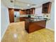 Well-equipped kitchen featuring stainless steel appliances, granite countertops, and center island at 6806 Monique Ave, Tampa, FL 33625