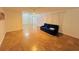 Comfortable living room with tile flooring, ceiling fan, and a cozy blue sofa at 6806 Monique Ave, Tampa, FL 33625