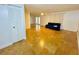 Spacious living room with tile flooring, ceiling fan, and large closet near the entryway at 6806 Monique Ave, Tampa, FL 33625