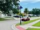 Charming neighborhood street view with well-maintained lawns and a clear street sign at 6806 Monique Ave, Tampa, FL 33625