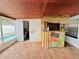 View of a covered brick patio area with a built-in tiki bar and access to the pool at 6806 Monique Ave, Tampa, FL 33625