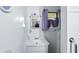 Cozy bathroom featuring a single vanity, a mirror with decorative flowers, and a window with curtains at 242 Zoller St, Brooksville, FL 34601