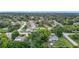Aerial view of the neighborhood shows mature trees and well-maintained homes at 7318 Tranquil Dr, Spring Hill, FL 34606