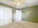 Bedroom featuring plush carpet, ample closet space, and fresh paint at 7318 Tranquil Dr, Spring Hill, FL 34606