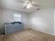 Bedroom with neutral walls, carpet flooring, a window and ceiling fan at 7318 Tranquil Dr, Spring Hill, FL 34606