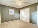 Bedroom featuring carpet flooring, a standard closet, and natural light at 7318 Tranquil Dr, Spring Hill, FL 34606