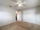 Bedroom featuring neutral walls, carpet flooring, standard closet and window at 7318 Tranquil Dr, Spring Hill, FL 34606