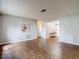 Bright living room boasts wood-look tile floors and neutral paint, creating a warm atmosphere at 7318 Tranquil Dr, Spring Hill, FL 34606