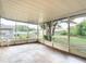 The screened-in patio offers an enjoyable view of the green backyard at 7318 Tranquil Dr, Spring Hill, FL 34606
