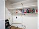 Storage area features white shelving and wooden flooring at 7318 Tranquil Dr, Spring Hill, FL 34606