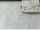 Close-up of a countertop sample featuring a light gray pattern to complement your modern kitchen design at 5514 Ocean Breeze Dr, Spring Hill, FL 34609