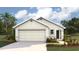 Charming single-story home featuring a classic design and a well-manicured front yard at 11753 Memorial Dr, Brooksville, FL 34613