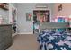 Well-lit bedroom with gray furnishings, carpeted floors, and closet with ample storage space at 14025 Canyon Swallow Rd, Weeki Wachee, FL 34614