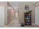 Entryway with tile flooring, neutral colored walls, and a bookcase at 14025 Canyon Swallow Rd, Weeki Wachee, FL 34614