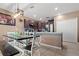 Kitchen and dining area featuring dark cabinets, stainless appliances, and a kitchen island at 14025 Canyon Swallow Rd, Weeki Wachee, FL 34614