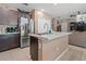 Kitchen boasts a center island, stainless refrigerator, and dark wood cabinetry at 14025 Canyon Swallow Rd, Weeki Wachee, FL 34614