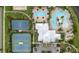 An aerial view showcases the community pool, clubhouse, and sports courts at 5528 Summer Sunset Dr, Apollo Beach, FL 33572
