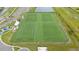Overhead capture of a sports complex with multiple artificial turf athletic fields and parking for ample sporting events at 5528 Summer Sunset Dr, Apollo Beach, FL 33572