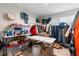 Spacious storage room with ample shelving, garment racks, and a window at 5528 Summer Sunset Dr, Apollo Beach, FL 33572
