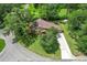 An aerial shot reveals the home's well-manicured lawn, mature trees, and extended driveway at 39 Sunset Dr, Brooksville, FL 34601