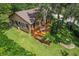 Aerial view showcases a spacious backyard deck, perfect for outdoor dining and entertaining at 39 Sunset Dr, Brooksville, FL 34601
