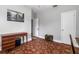 Bedroom features hardwood floors, vintage chest, and built-in shelving at 39 Sunset Dr, Brooksville, FL 34601