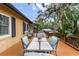 Large outdoor deck with seating and a view of the surrounding landscape at 39 Sunset Dr, Brooksville, FL 34601