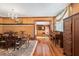 Open dining room with hardwood floors leading to an adjacent bedroom at 39 Sunset Dr, Brooksville, FL 34601
