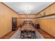 This large dining room features a decorative fireplace, chandelier, and rug at 39 Sunset Dr, Brooksville, FL 34601