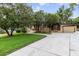 Well-maintained home featuring a tidy lawn, mature trees and an attached garage at 39 Sunset Dr, Brooksville, FL 34601