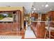 Hallway between the living room and kitchen with hardwood floors and wood trim at 39 Sunset Dr, Brooksville, FL 34601