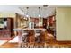 Open kitchen layout featuring granite countertops, custom cabinets, and a large island at 39 Sunset Dr, Brooksville, FL 34601