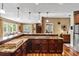Expansive kitchen island with granite countertop and custom cabinets for ample storage at 39 Sunset Dr, Brooksville, FL 34601