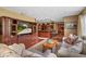 Cozy living room features a wooden entertainment center and opens to the kitchen at 39 Sunset Dr, Brooksville, FL 34601