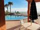 Community pool area with tables and chairs at 15316 Gulf Blvd # 301, Madeira Beach, FL 33708
