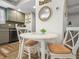 Small dining area with round table and chairs at 15316 Gulf Blvd # 301, Madeira Beach, FL 33708