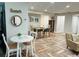 Bright dining area with table and chairs, and beachy decor at 15316 Gulf Blvd # 301, Madeira Beach, FL 33708