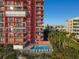 Aerial view of condo building pool and surrounding area at 15316 Gulf Blvd # 301, Madeira Beach, FL 33708