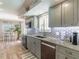Modern kitchen with granite countertops and stainless steel appliances at 15316 Gulf Blvd # 301, Madeira Beach, FL 33708